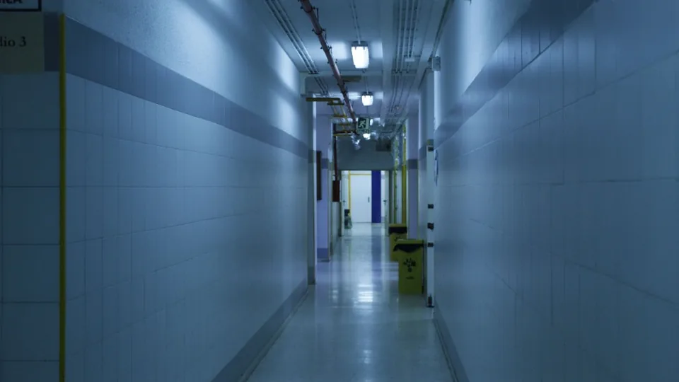 Institutional corridor with emergency exit sign