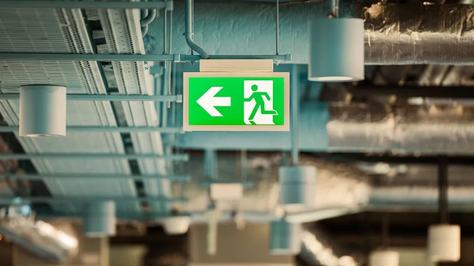 Emergency exit sign in an industrial plant room